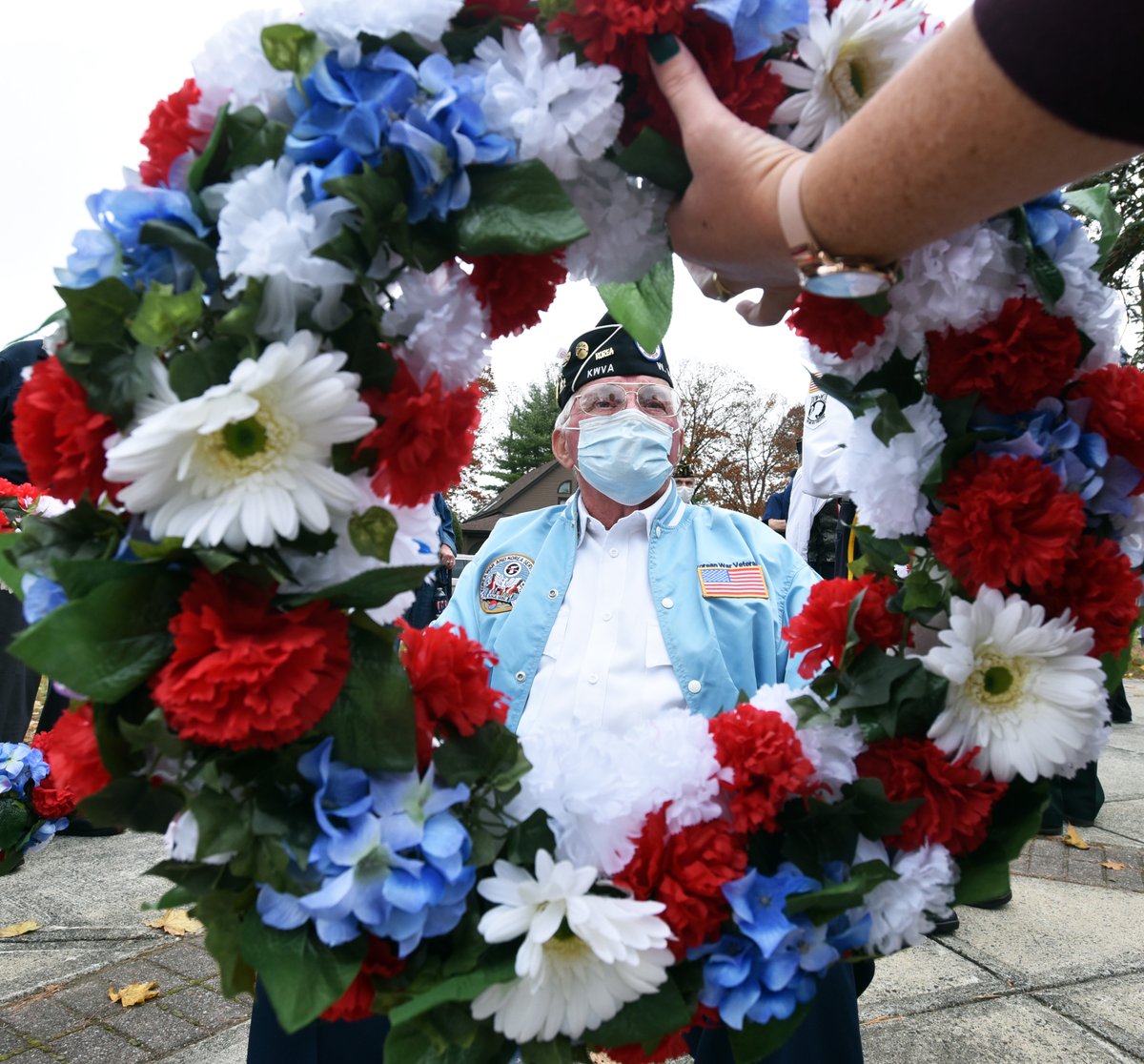 Veteran Ron LaPlante is handed a wreath to be laid during Veterans Day ceremony in <a href="/Chicopee_MA/">City of Chicopee</a> .  #VeteransDay2020