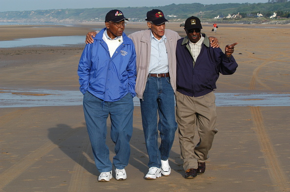 Dad rarely spoke about the war, but a Getty Images caption says he wrote a letter to Eleanor Roosevelt to integrate the troops in 1943. Through her, he joined the 1st Infantry Division, a platoon known as the "Big Red One." Here he is with some other Black WWII vets in 2004. 3/
