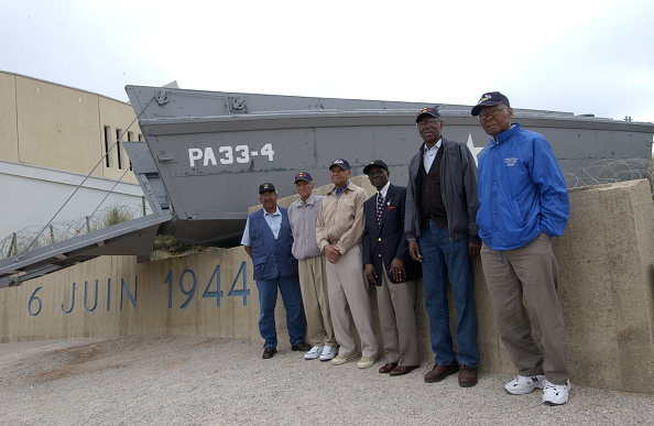 Dad rarely spoke about the war, but a Getty Images caption says he wrote a letter to Eleanor Roosevelt to integrate the troops in 1943. Through her, he joined the 1st Infantry Division, a platoon known as the "Big Red One." Here he is with some other Black WWII vets in 2004. 3/