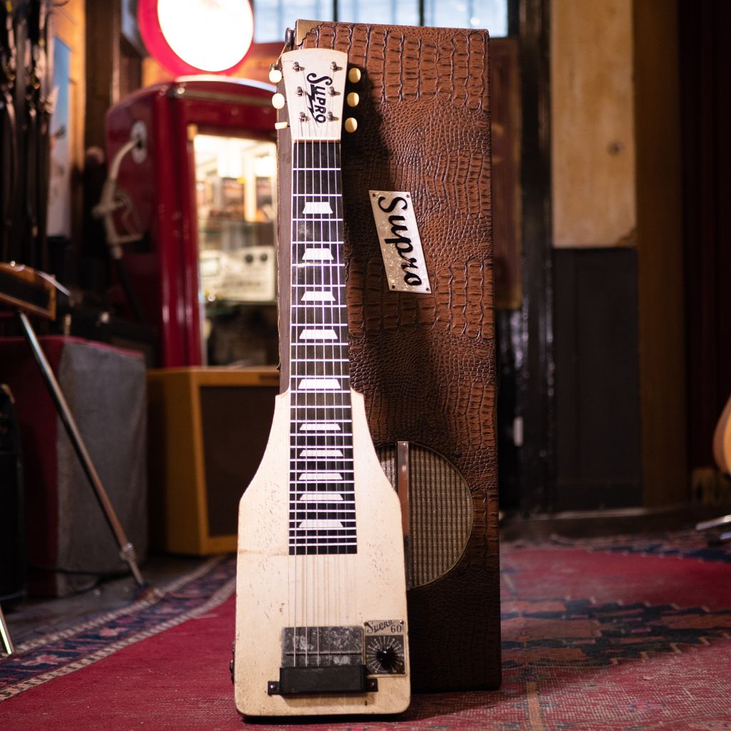 We are always on the lookout for interesting lapsteels, and this 1939 Supro Model 60 is the coolest we've had for some time! Typical Supro styling that screams old school 'Americana' and a 10w original amp-in-case with original 10" Jensen speaker. This thing gets growly!