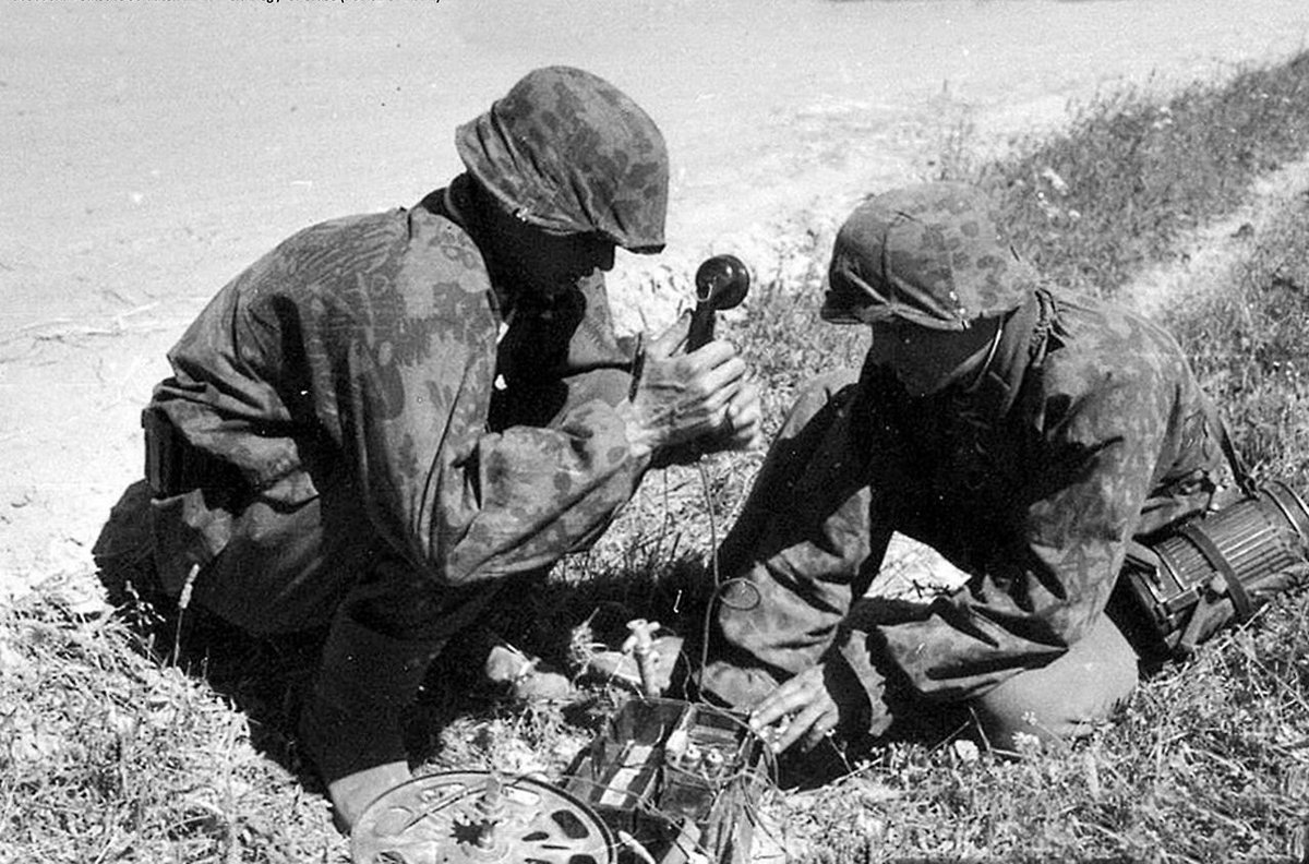 The back pack cable reel could accommodate up to 5km of line. The Kriegsberichter continues the pictorial story after the cable has been laid & is affixed to the field telephone. 47b)