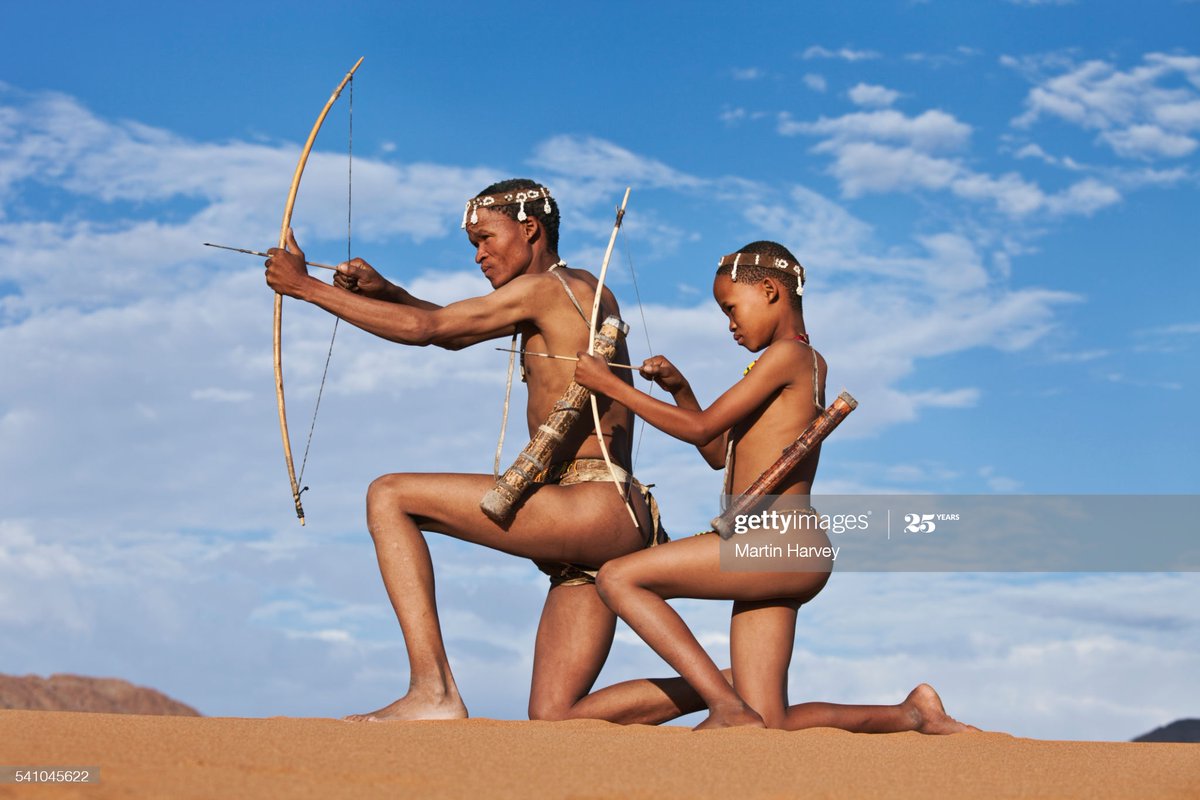 “These images abound, generally of people pretending to hunt. This photograph (on the right) is of San people in a pose that is associated with Aboriginal Australians. I’ve never seen a San person stand like this in my life.” – Paul Weinberg
