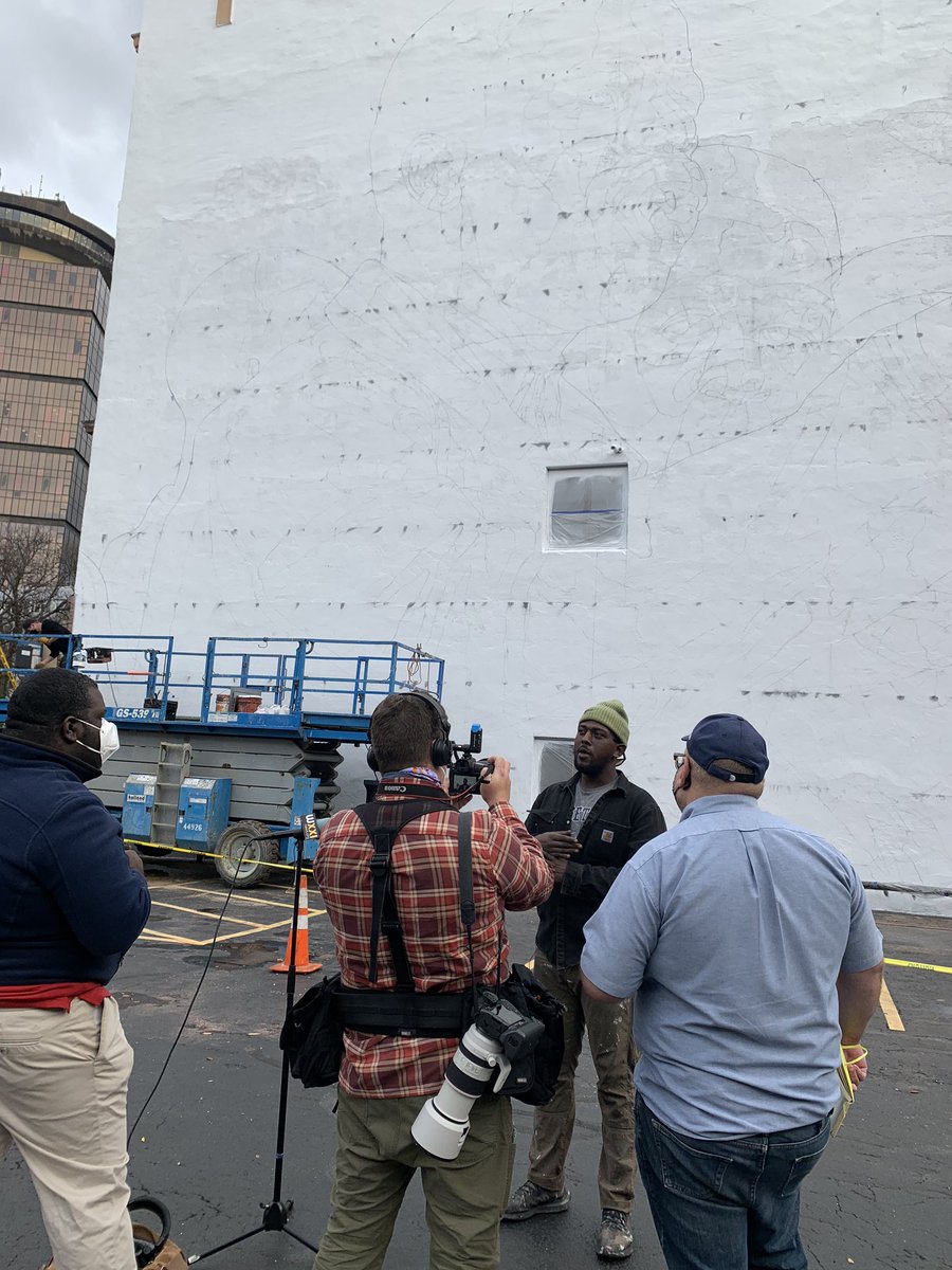 Ephraim Gebre talking with media this afternoon about the John Lewis mural he’s working on with a group of artists on State Street.