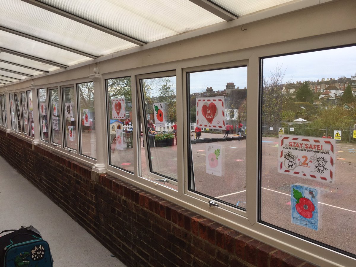 Hertfordinf's tweet photo. Poppies appeared in the corridor today as we paid our respects to those that have lost their lives in war.  Well done to all our little ones who did 2 mins silence at 11am https://t.co/Y0nfYdqtUr