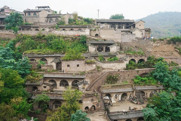 This is mainly because of China, btw.A lot of people in the north of China live in Yaodongs, which are artificial caves.You basically dig horizontally into a hillside, and it has the benefit of having a very stable temperature. So it's cool in the summer and warm in the winter.