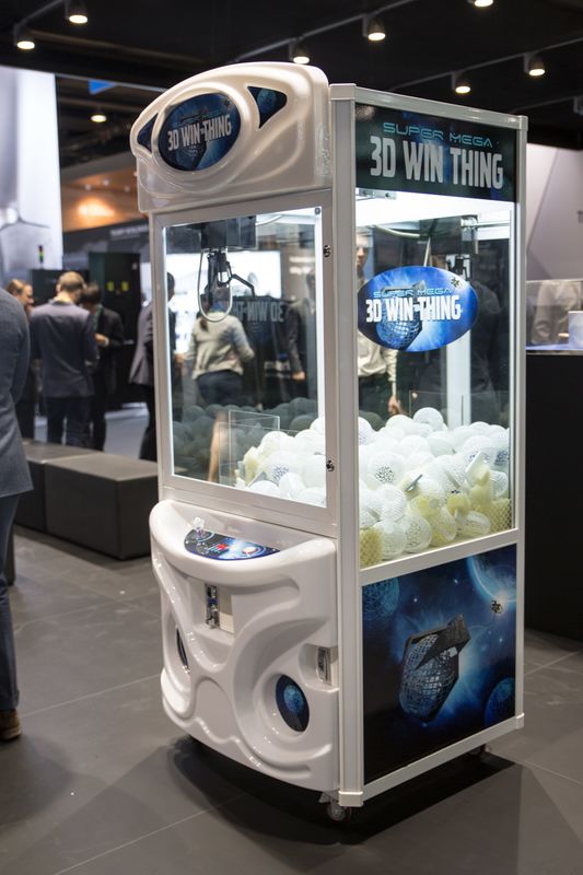 MaterialiseNV's tweet photo. With #formnextconnect going on, we're taking a trip down memory lane to @formnext_expo 2017, where we had some fun with our claw machine powered by 3D printed grippers and stuffed with 3D printed goodies. Did you happen to be one of our lucky winners? https://t.co/fGOGbgsvDf