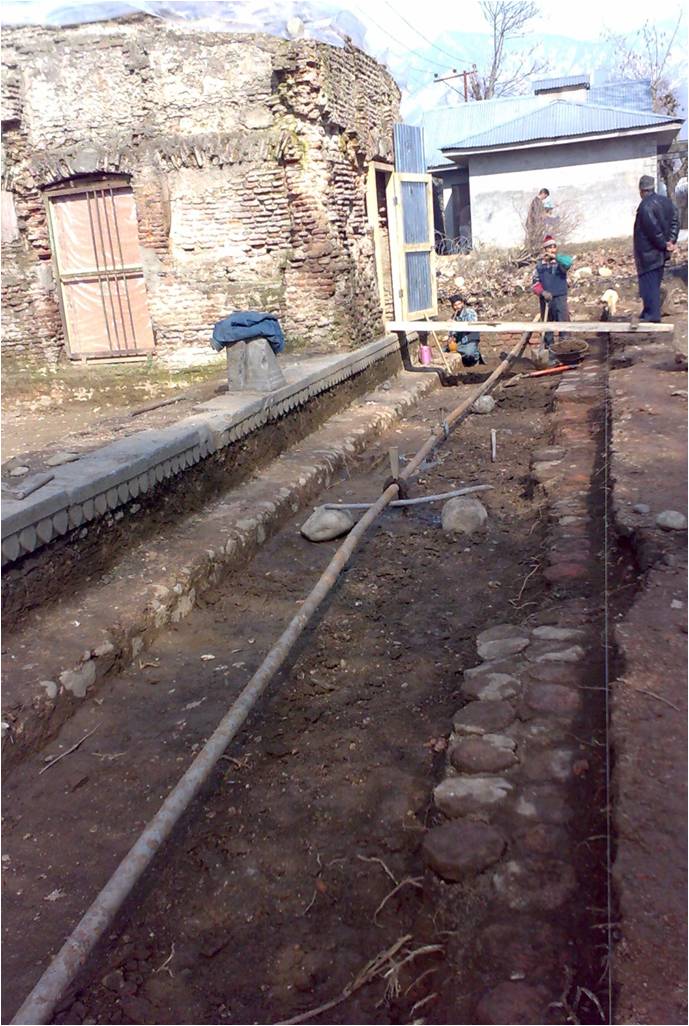 During the excavation we found traces of the original Mughal pathway and Mughal terracotta tiles buried some 2 feet below earth. These tiles are the only such found (so far) in Kashmir, & more importantly trace the original Mughal material used for paving, unlike the Devri 3/