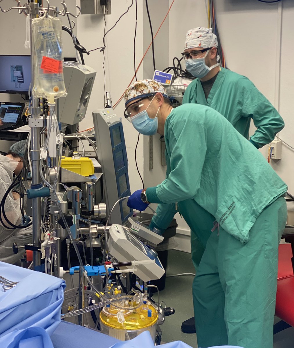 Perfusionists practice their protocol to manage an intra operative air embolism during a simulated event.