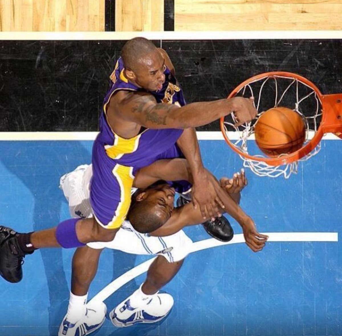 Ballislife's tweet photo. 16 years ago today, Kobe Bryant baptized Dwight Howard! 

One of the greatest posters ever. https://t.co/Dze8Kx0o0O