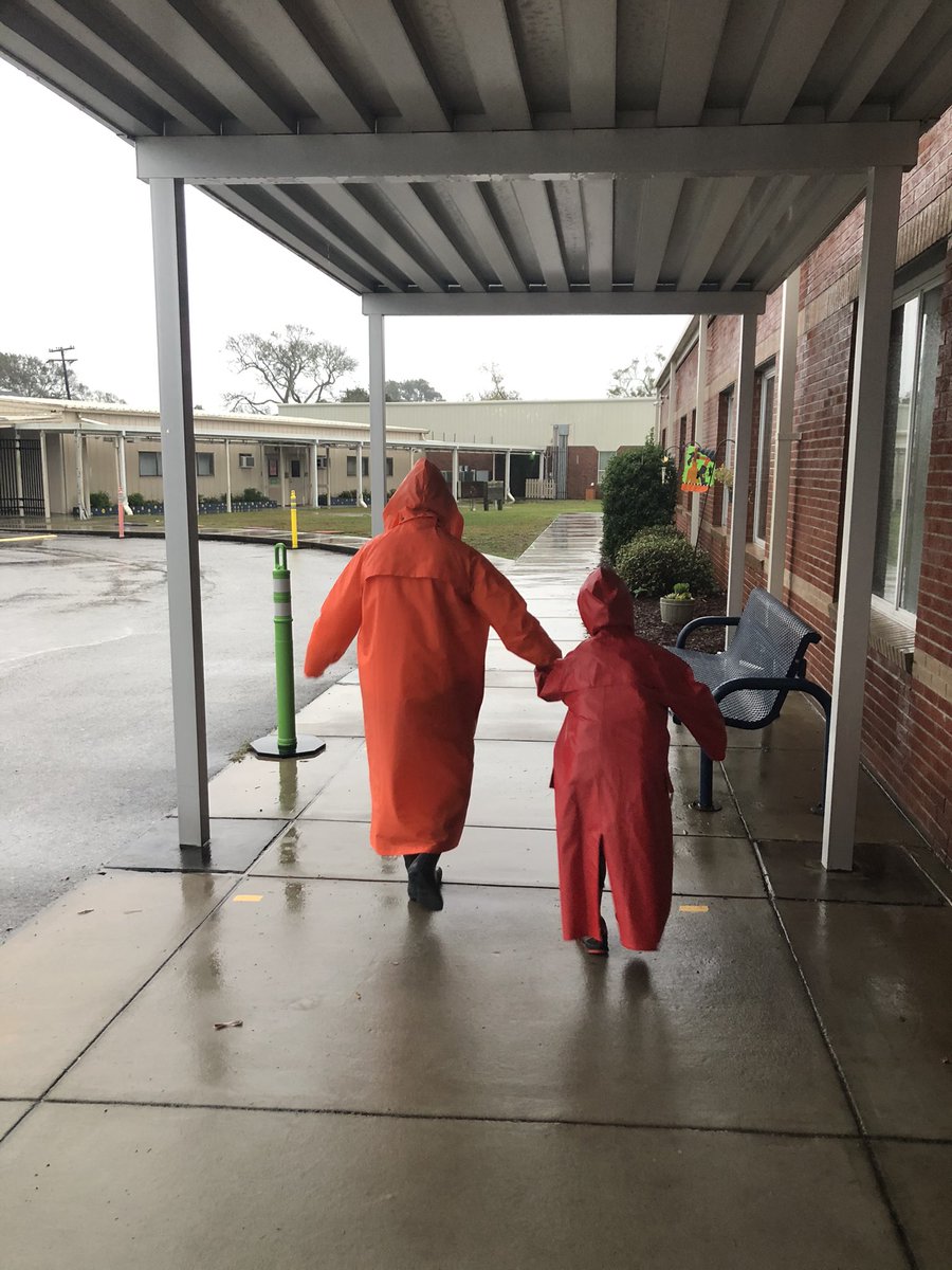 jody_mcclenny's tweet photo. When a parent can’t get to the school because of the rain, the assistant principal walks the child home to ensure he gets there safely! @LaurenDudeck #neshawks https://t.co/ga2KIQpp0I