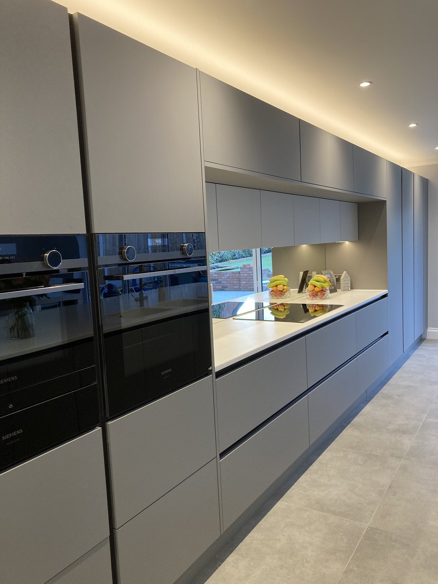 Absolutely stunning, beautiful handleless kitchen in Mayfair Dust Grey and Dove Grey with Tristone work top and Siemens appliances and abode hot tap @Daval_Furniture #handlelesskitchen #greykitchen #essex #brentwood #billericay #shenfield