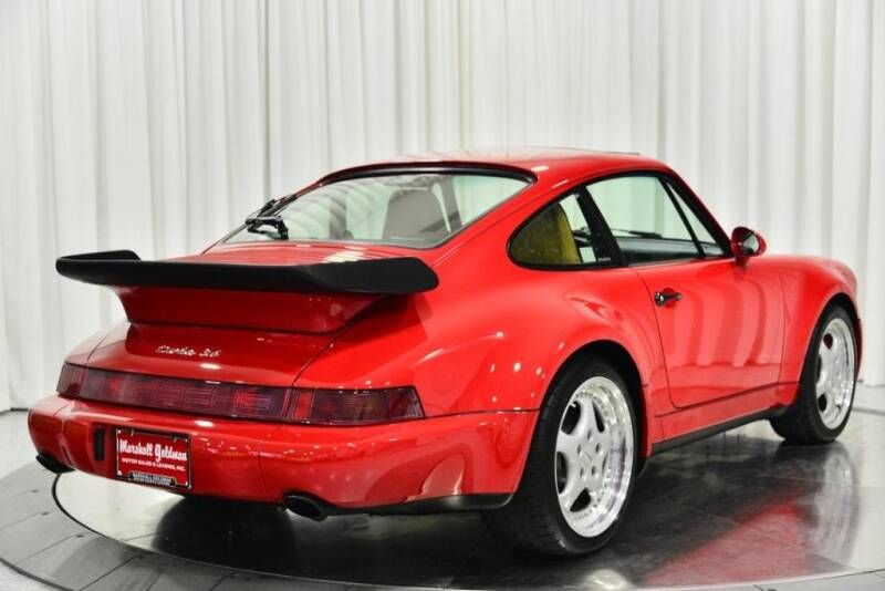 PorscheMarket's tweet photo. This 1994 #Porsche 964 Turbo Coupe is finished in the classic Guards Red over a Champagne leather interior. It has just over 16k original miles and is equipped with a manual transmission. #Classifind

▶️ https://t.co/x3MStWE7S0 https://t.co/vO9ZufFWvw