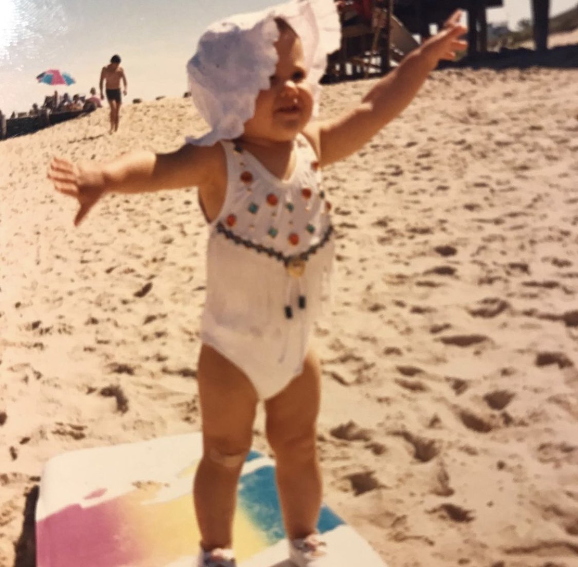 let’s start out with baby pictures. always been tan. and in those two pictures with her father she is the same shade as him.