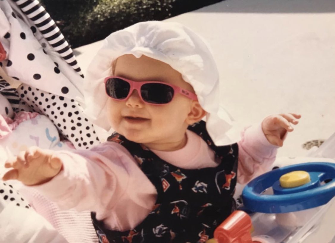 let’s start out with baby pictures. always been tan. and in those two pictures with her father she is the same shade as him.