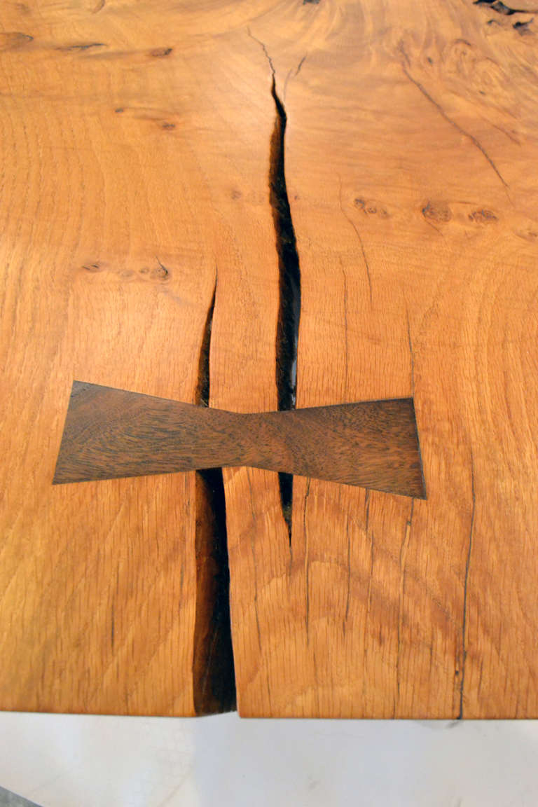 One such joint piece, the chigiri or butterfly joint, became a calling-card feature of Nakashima's furniture; in the U.S., it's pretty much known as "the Nakashima joint." It's traditionally used to join two boards, but Nakashima also uses it to reinforce flaws in a single board: