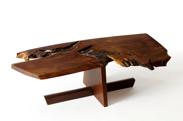 Another key feature of Nakashima's style is his use of free- or live-edged boards for his surfaces. This centers the natural beauty of the wood used and the "spirit of the tree" that gave its vitality to the piece.