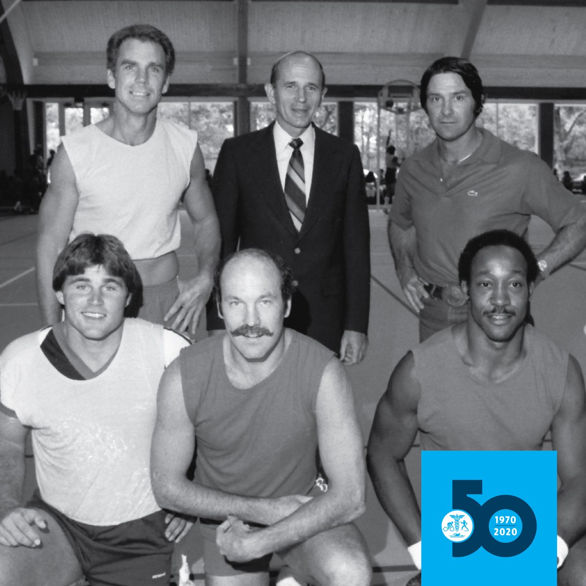 CooperAerobics's tweet photo. Cooper, circa 1982. Dr. Kenneth Cooper gathered with Dallas Cowboys legends Roger Staubach &amp; Walt Garrison (top row), and Dave Peck (pro raquetball player), Cliff Harris &amp; Preston Pearson (bottom row) at #CooperFitnessCenter's grand reopening celebration. #cooper50 #tbt #cowboys https://t.co/vnTrVakfYx
