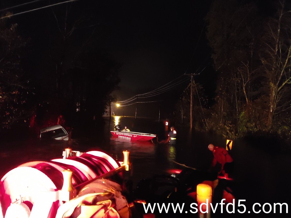 Crew with Raft 5 rescuing two occupants last night after their vehicle was swept away in flood water on Medleys Neck Road in Leonardtown.