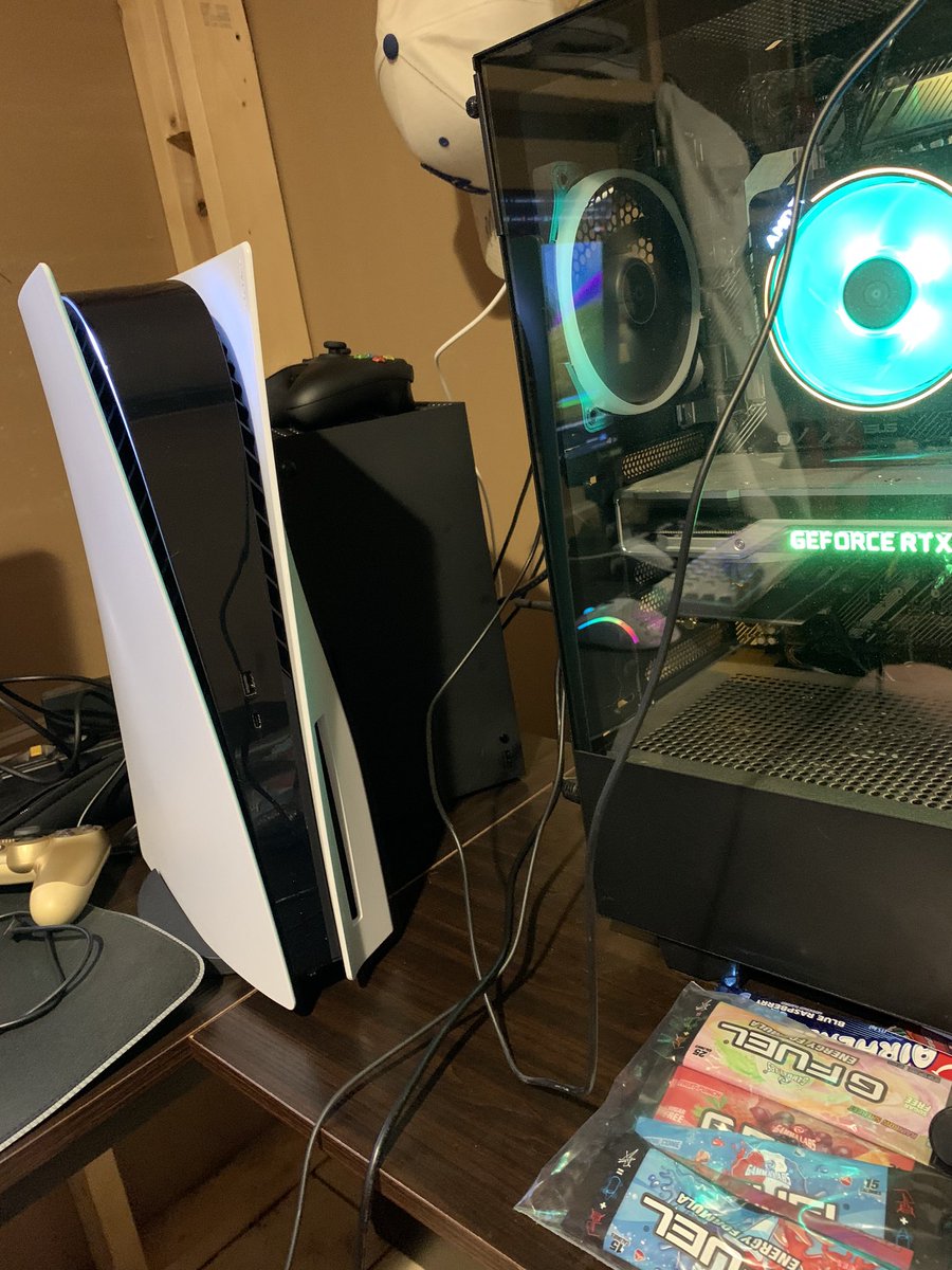 TrentTheSlayer's tweet photo. The trio ��� PS5 + Xbox Series X + PC. Can’t forget the @GFuelEnergy either #PS5 #XboxSeriesX https://t.co/RKWBJlZW7x