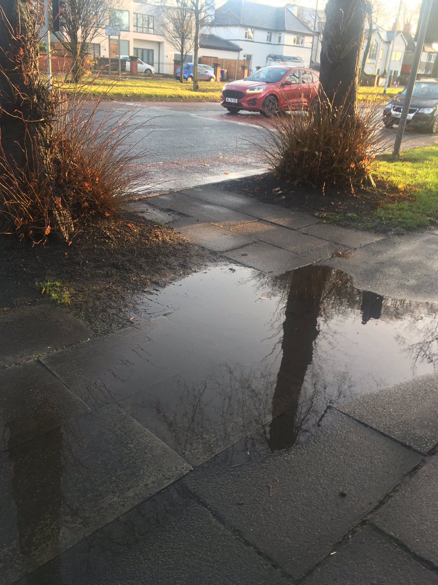And then at the top of this road she’s need to get across this major intersection. The quickest way, for sone reason, has no pedestrian lights, despite taking pedestrians into the line of turning traffic with very poor visibility. (Also lots of puddles today.)