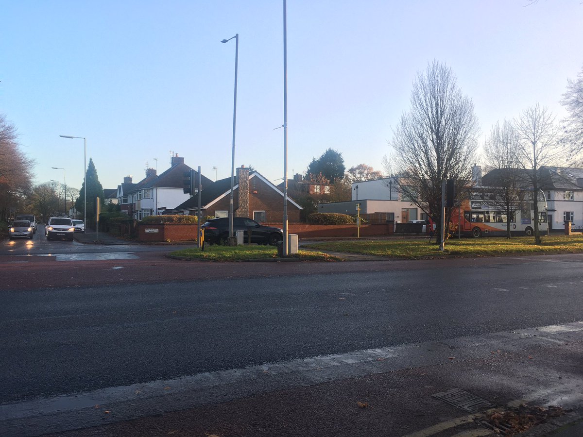 And then at the top of this road she’s need to get across this major intersection. The quickest way, for sone reason, has no pedestrian lights, despite taking pedestrians into the line of turning traffic with very poor visibility. (Also lots of puddles today.)