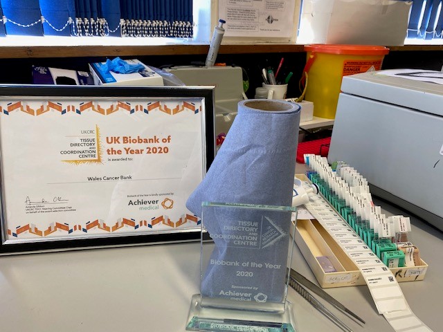 walescancerbank's tweet photo. It's arrived! UK Biobank of the Year 2020 trophy has made it to Cardiff - thank you for sponsoring @AchieverMedical #bbshowcase. The usefulness of blue roll has no limits!🤣🤣 https://t.co/wRq6tNXsMs