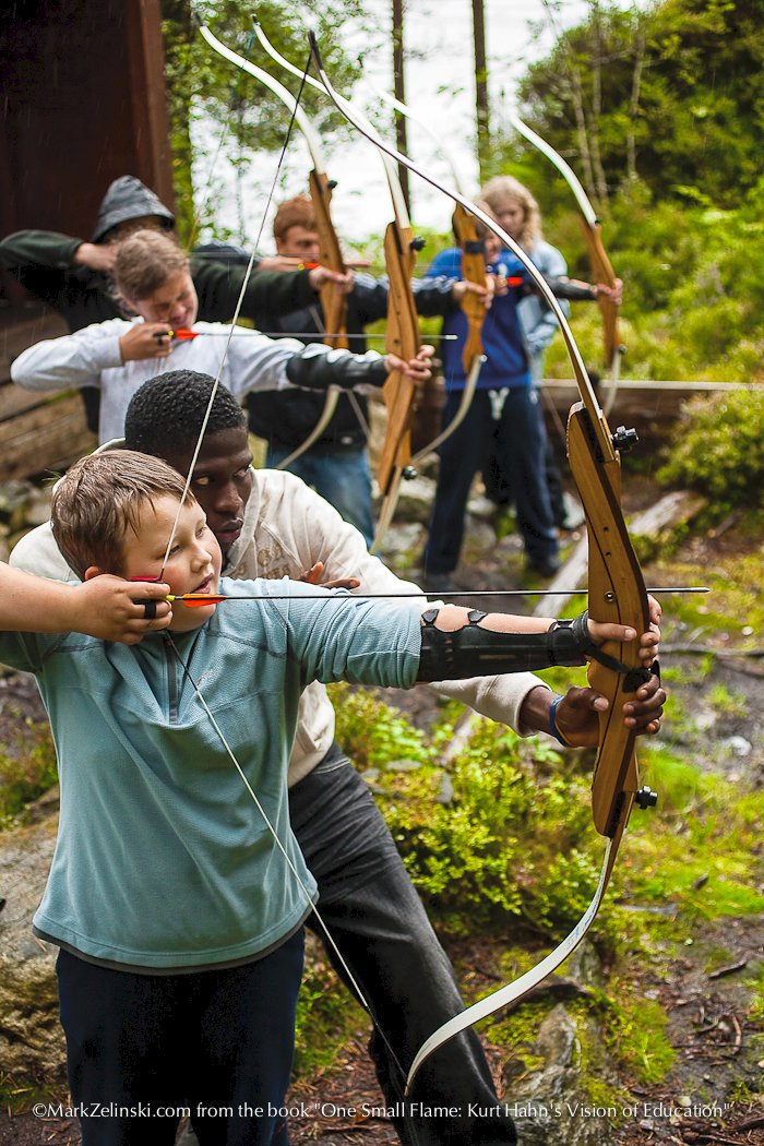MarkZelinski's tweet photo. #Student becomes #teacher, guiding youth from nearby #schools through challenging activities like #archery. #OneSmallFlame book Page 48 @UWCRCN #Norway https://t.co/wiyXPyvFf4 #WritingCommunity #BooksThatHeal @UWC_IO @UWCUSA @UWCAtlantic @PCUWC @uwc_bosch @UWC_Mostar @UWCAdriatic https://t.co/zo8dpQbgCP
