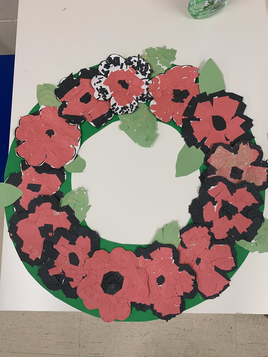 EmilyHelgerman's tweet photo. The poppy wreath made by 5-2 students turned out great! Lest we forget. https://t.co/cpOwEu7xKV
