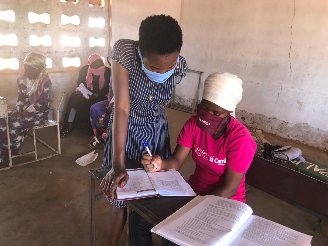 llysa200's tweet photo. In small clusters, the young women come together to recieve guidance from their @Camfed Transition Facilitators on life skills and varied pathways to their economic independence. They document their journey and aspirations in a journal. #CAMAEffect  @youngafricawks https://t.co/ApcWr4vP8f
