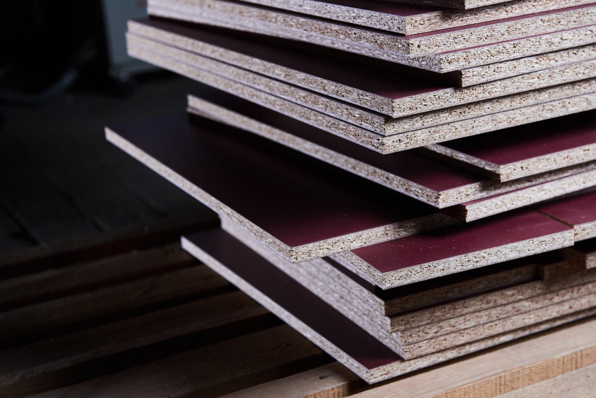 Chipboard generally has very little moisture resistance but it is strong, cheap and very tolerant to the drying effects of central heating, when covered, it is commonly used in furniture and kitchen units./9
