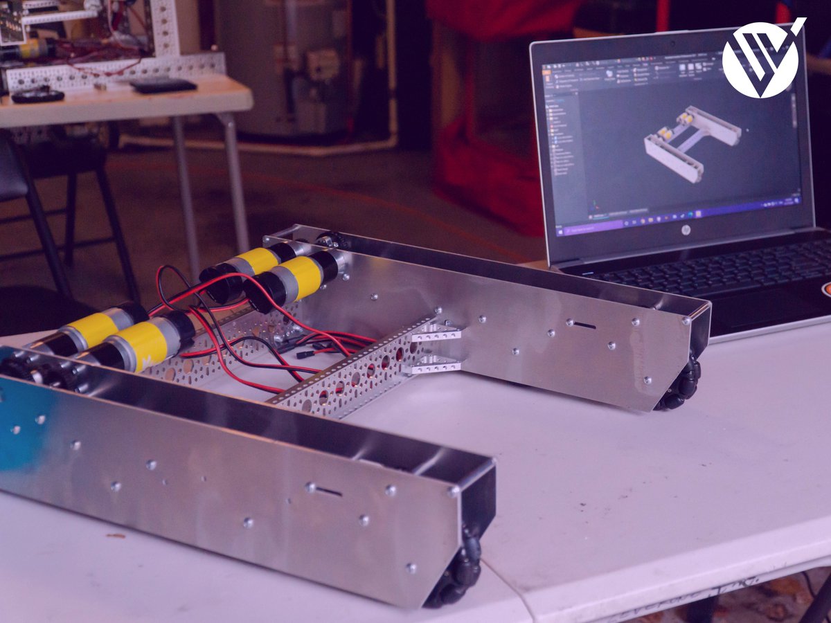 UltravioletFTC's tweet photo. This is the first iteration of our drivetrain. It's got eight wheels, each driven by way of pulley. The electronics will be mounted this week, and it'll be operable once we get the belts. Big things coming. :) https://t.co/NjTDaJWuuc