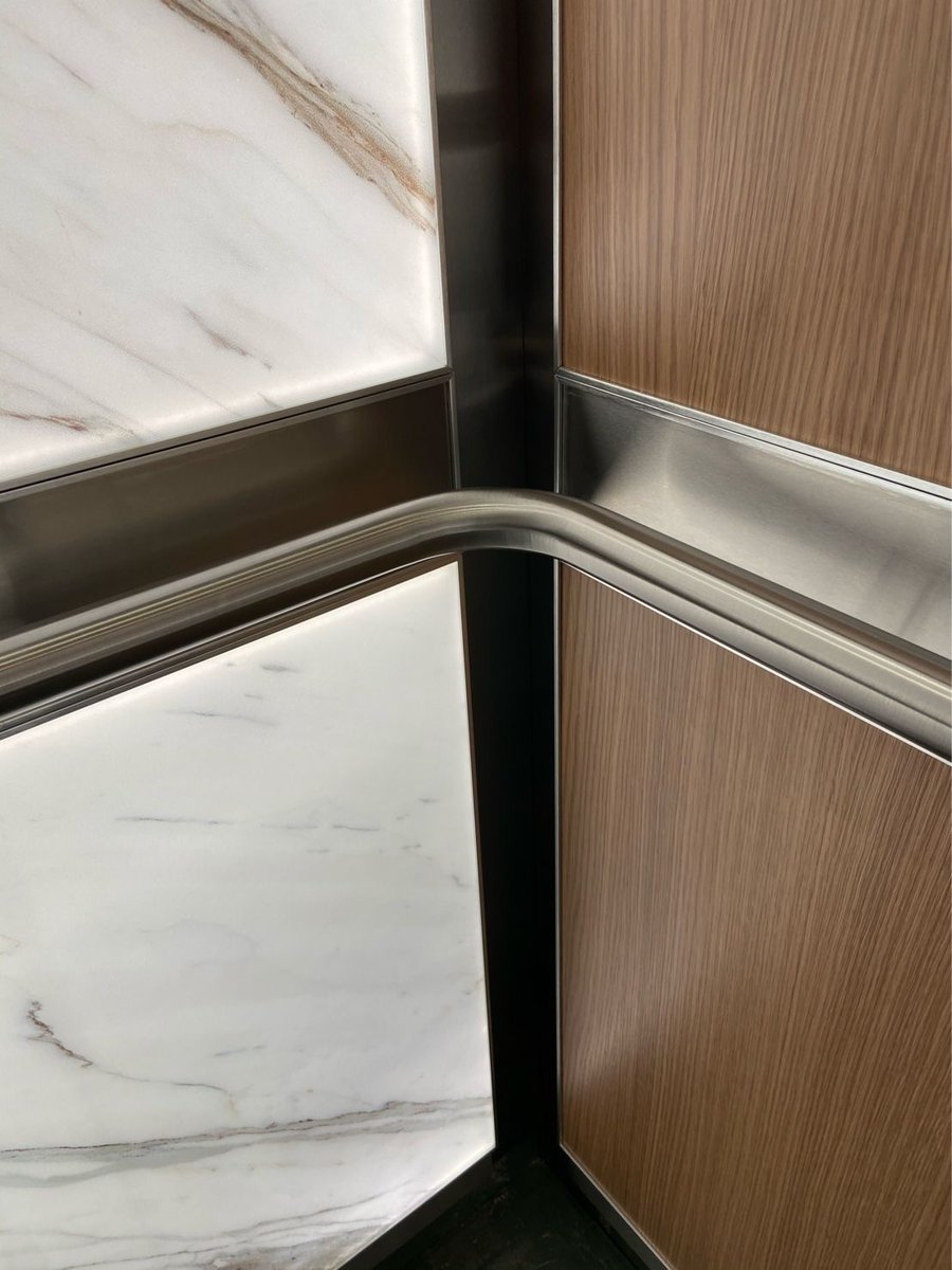 Here’s a recent mock-up of one of the elevator interiors at “The Well” project.  The Well is a landmark multi-building, multi-use new construction project in downtown Toronto.
We’re using back-lit graphical images of real marble slabs. Rear walls have wood veneer.