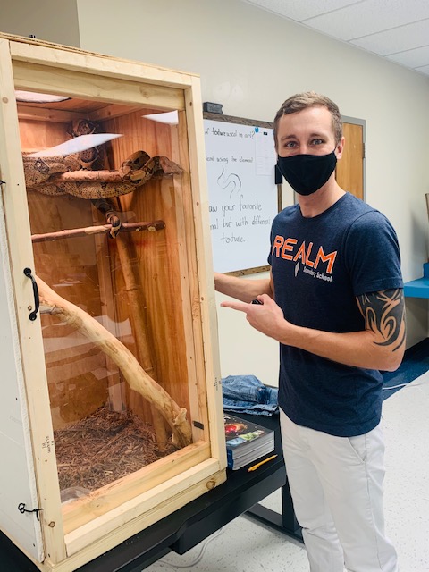 Mr. Black's class has a "lively" feel today with an engaging texture and still life lesson from his 7'2" red-tail boa named Chile. #REALMrocks #lockedtank
