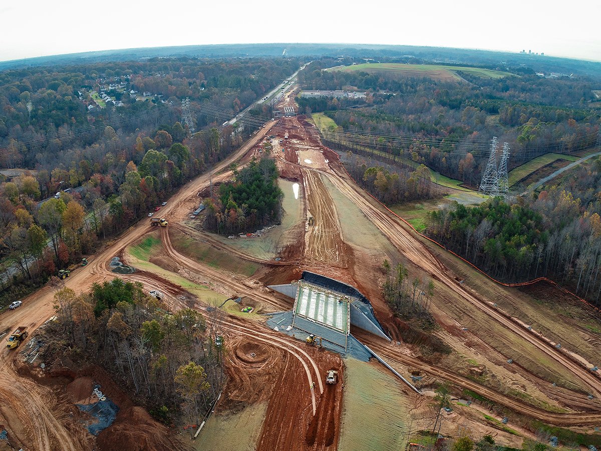 BlytheConst1's tweet photo. Blythe Construction teams are hard at work on multiple sections of the Winston-Salem Northern Beltway! Future US-52 alignment is currently underway, and ramps and loops of the NC65/US52 interchange are now complete. #WinstonSalem #NorthernBeltway https://t.co/TxpLyZ47Ab