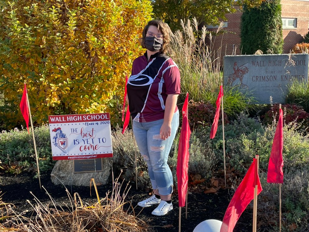 WallTwpSAC's tweet photo. More 2020 Red RIbbon Week Photos: 
WHS 12th Grader, Renee Grunwald assisted Mrs. Regenye with placing Red Ribbon Flags in Front Entrance Garden on Monday 11/9/20. @WHSDeltaClub @WallTwpSchools https://t.co/FBEnU5hsbA
