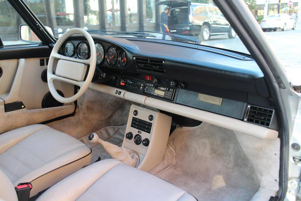 PorscheMarket's tweet photo. This 1989 #Porsche 911 Carrera is equipped with the special 25th Anniversary Edition package and is finished in Silver Metallic over a Silk Grey interior. It only has 19k miles and is equipped with the  G50 5 speed manual transmission. #Classifind

▶️ https://t.co/k8QOoJqyYl https://t.co/JEFFDYBsYm
