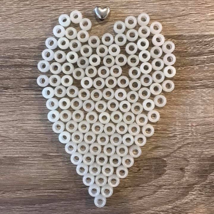 These are Jadyn’s glow in the dark Radiation Bravery Beads. She earned 123 of them—one for every treatment. Jadyn passed away in 2018, at 15. She was fierce.
 
"I will be sending them to SickKids to be part of the Monument to the Brave," says her mom. "Jadyn would be thrilled."