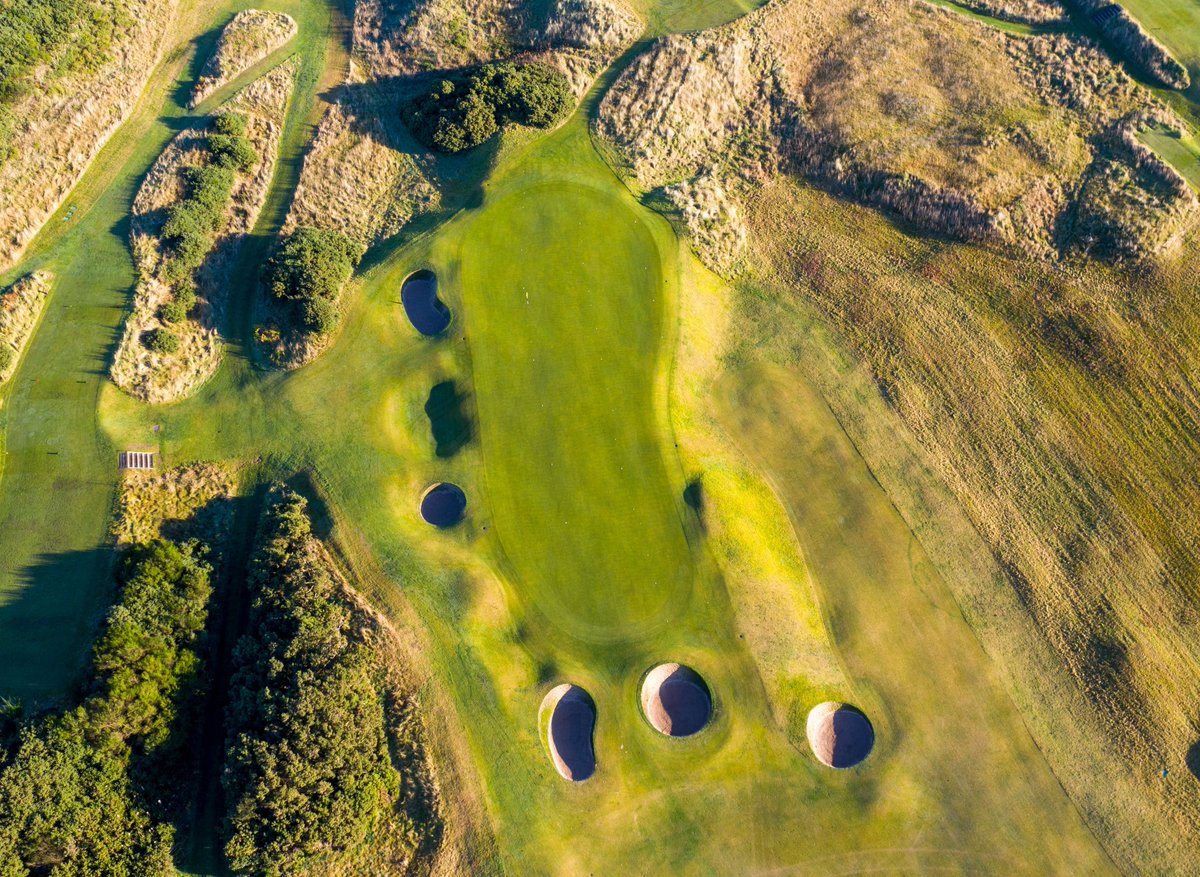 The fifth green is amazing. Best approached from the left half of the fairway. From the right, it's so narrow you'll do well to avoid the steep run off right or the pots to the left. The mid-right hole location a sucker pin which, if not played conservatively, will get you.