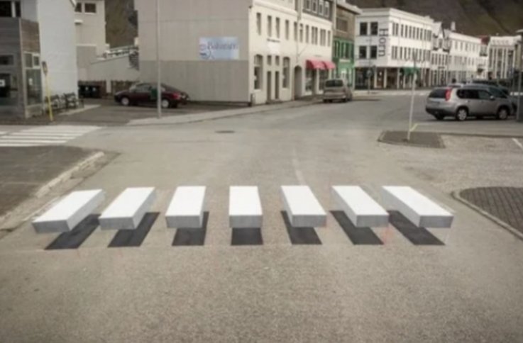 arqmona's tweet photo. En Islandia pintan así los pasos de peatones. El efecto visual obliga a parar. https://t.co/5v5lCPYJAR