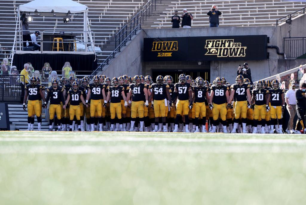 uiowa's tweet photo. Friday night lights, but make it @HawkeyeFootball.  💛🖤🏈 https://t.co/JqogpuHdAe