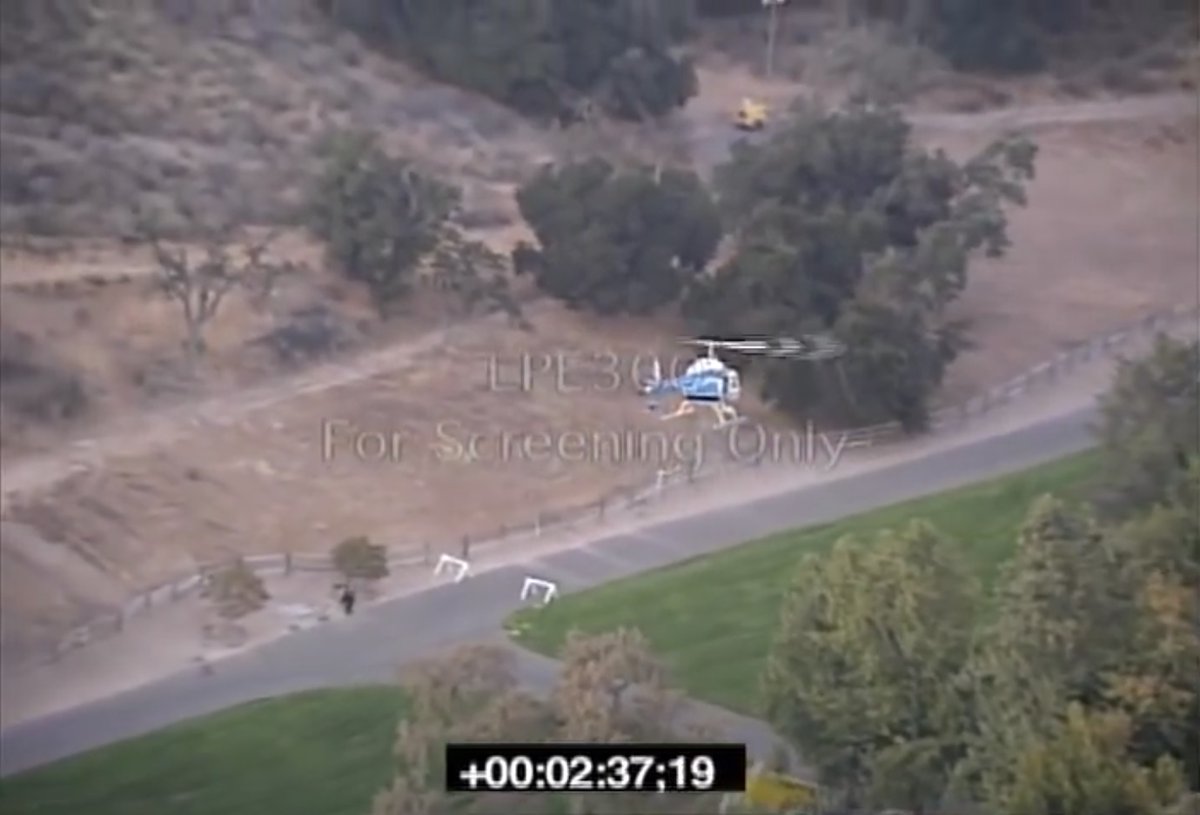 You can see the track is being excavated. That little yellow machine to the top right is a generator with lights on the top.It's too far away to be of any use to the wedding guests.Somebody wanted that track excavated, pronto. The workers were probably working into the night.