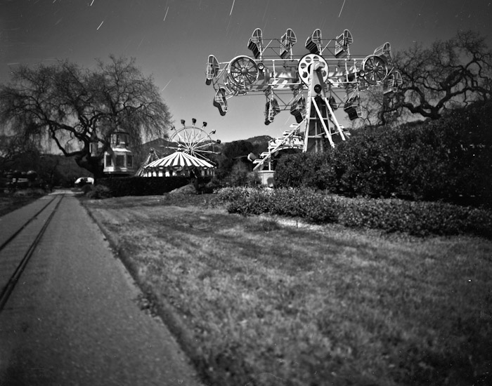 The Sea Dragon swinging boat ride. It was supposed to have been installed in Apr 92, but it's there at Liz's wedding. That glowing triangle behind the ferris wheel.Here's a similar shot (many years later) for comparison. And how it looked in Feb 93.