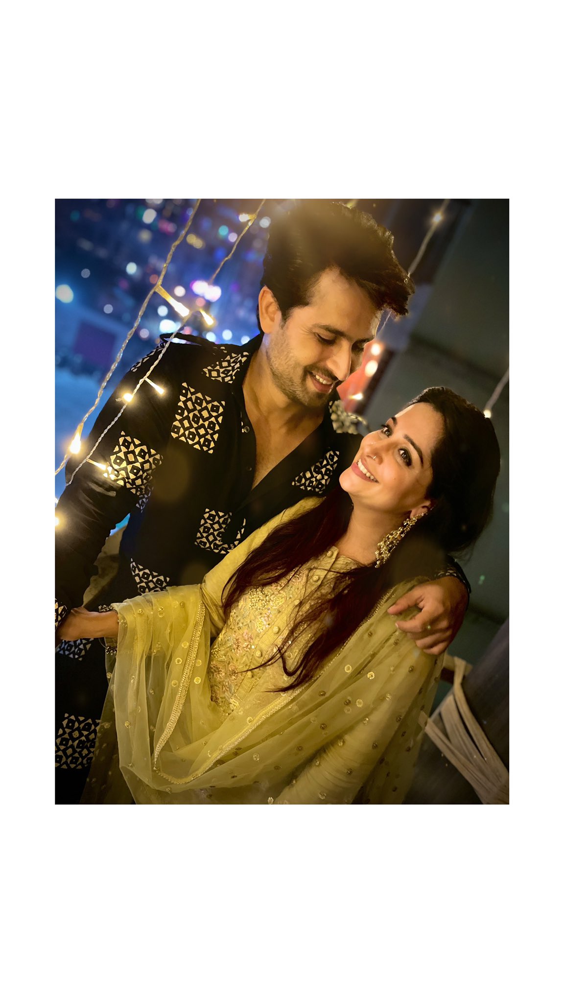 cheerful indian young couple welcoming on diwali night inside home with  diwali lighting, indian couple or people in namaskar pose welcoming guests  on diwali celebration or festival night Stock Photo | Adobe