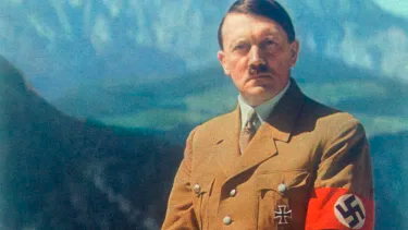 To make sure Tommy and I are on the same page, here's a photo of Adolf Hitler sporting a Nazi party armband. He was Germany's leader at the time and truly the ultimate baddie.