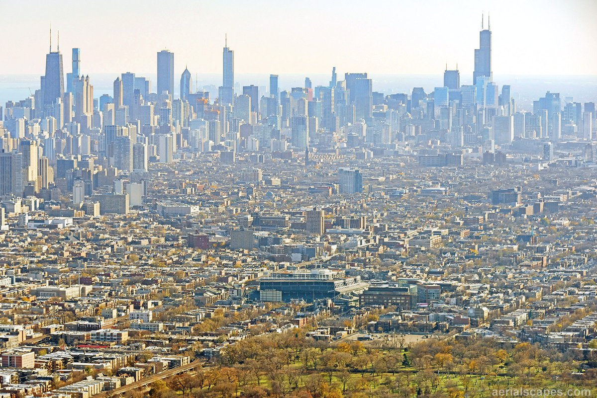 WrigleyAerials's tweet photo. Downtown Chicago looms large beyond Wrigley Field. https://t.co/j8NG1zoGgL