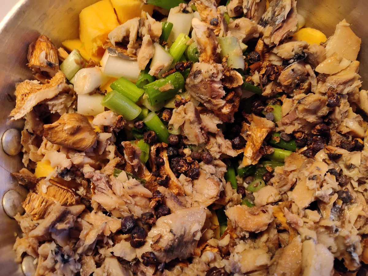 A palm full of lightly crushed juniper berries