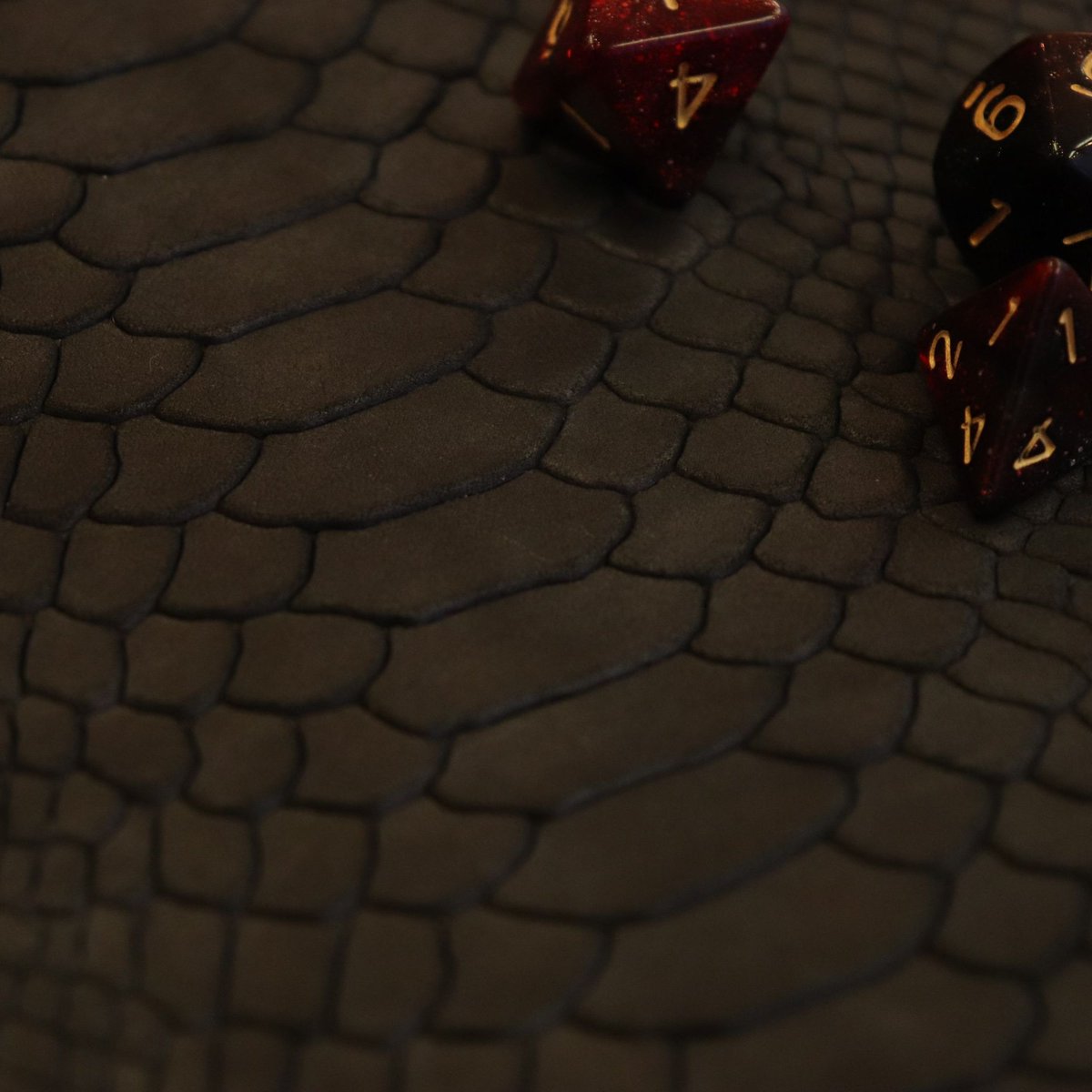CeryneianA's tweet photo. The new #ttrpg Dragon Scroll is coming to the @SpeechlessBard shop on Sat. November 21! With creme white leather (engraved with my new design) on one side and dark dragon hide on the other, plus space for two sets of dice in the pouch! Time of launch will come up this week ๐ฒ https://t.co/5I2sLGmTau