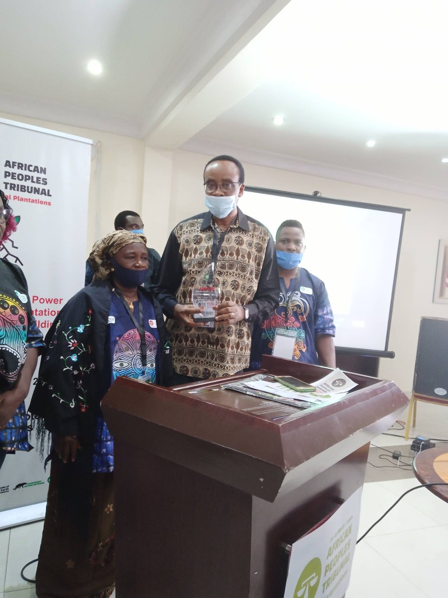 FoEAfrica's tweet photo. Presenting the award to the chairperson @NnimmoB by Hannah Deen at the African Peoples Tribunal @ERAFoEN1 #APT2020 https://t.co/tfMLvDzgis