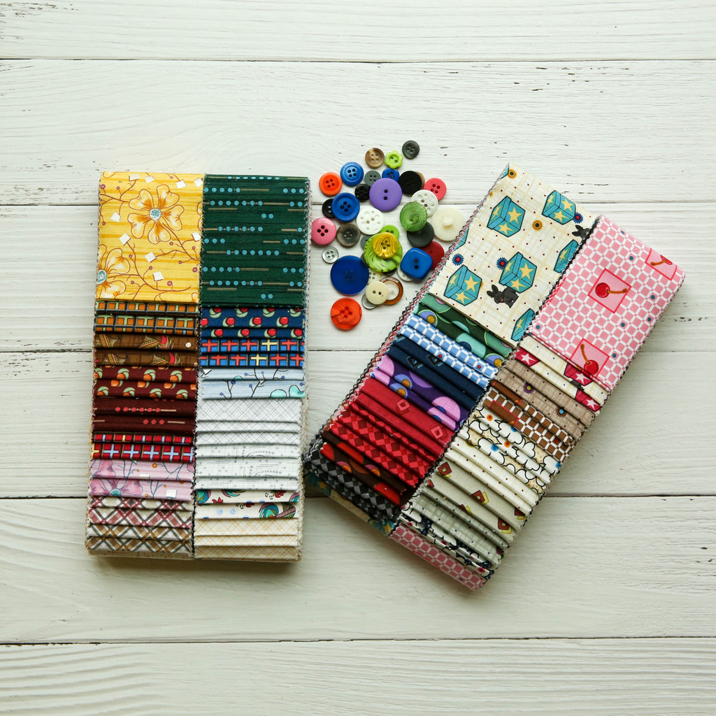 Benartex's tweet photo. The Lizzy Albright collection comes in 2 colorways! Cedar Chest (left) has fancy singing roosters &amp; fun flowers with fluffy marshmallows while Attic Window (right) features scottie dogs frolicking on boxes &amp; cherries in a grid - which is your favorite? https://t.co/Omf9vh9ZFk https://t.co/q6oyGNS1EN