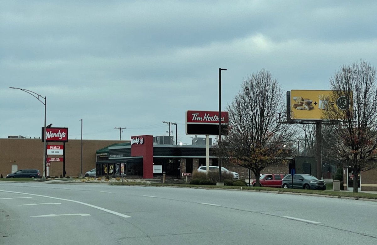 IdleAchiever's tweet photo. @McDonalds billboard right next to @Wendys? Kinda cut-throat. I like it. https://t.co/0cNYxpKCSw